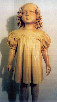 young girl wood sculpture